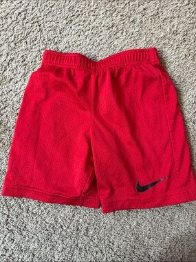 Nike Kids Red Mesh Athletic Shorts with Black Swoosh